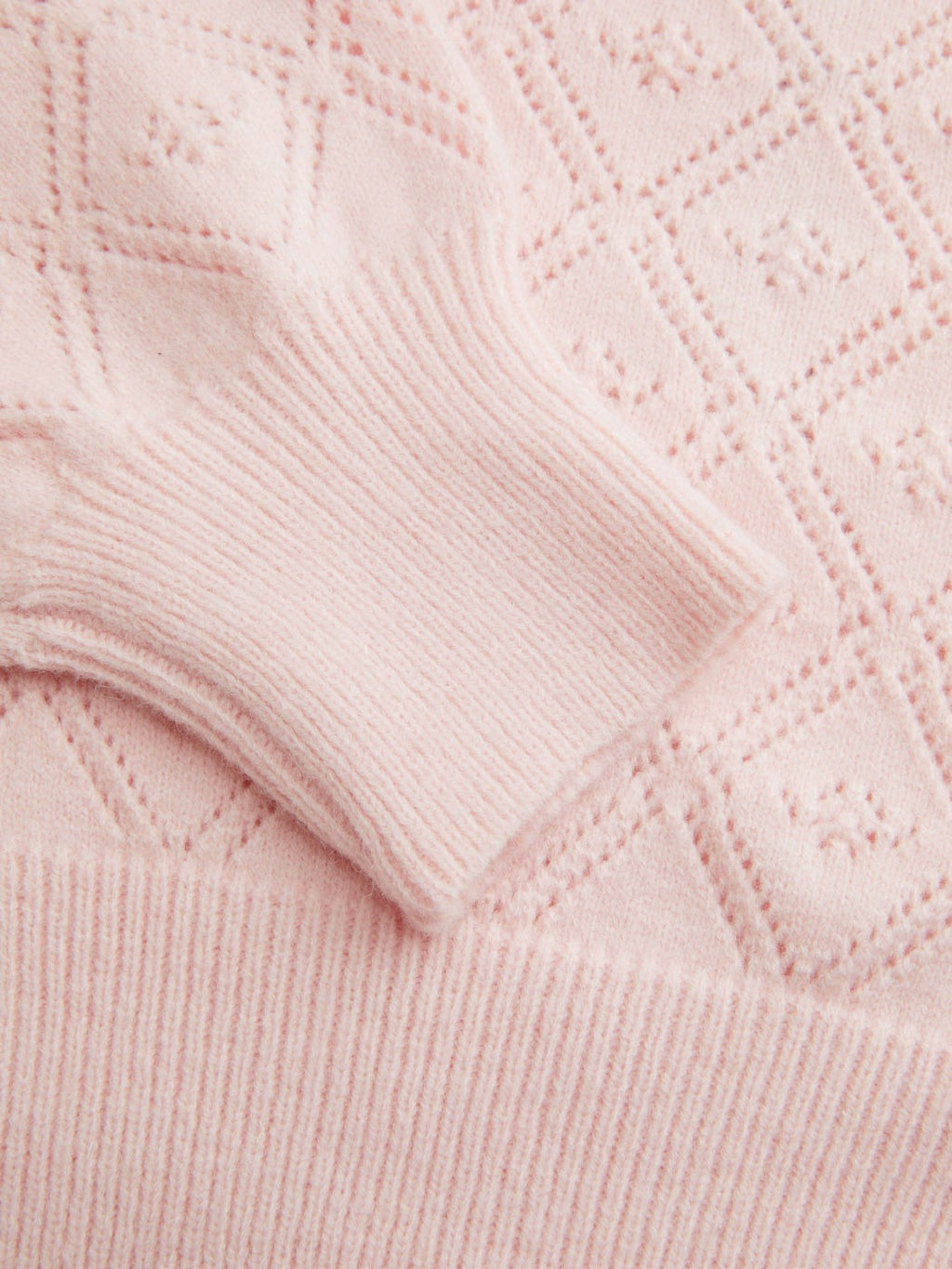 Jersey de punto rosa de hombro al descubierto